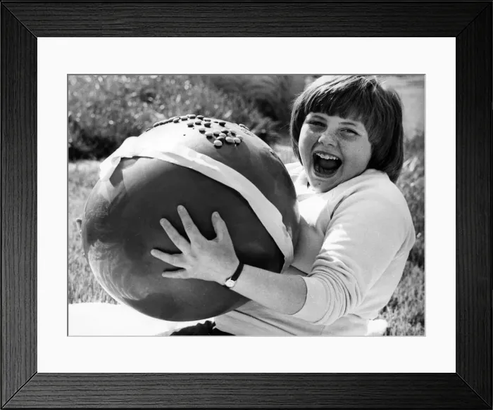 Framed Print : Lynn McGiven, pictured with her enormous prize, a large chocolate easter egg Framed Print : Lynn McGiven, pictured with her enormous prize, a large chocolate easter egg