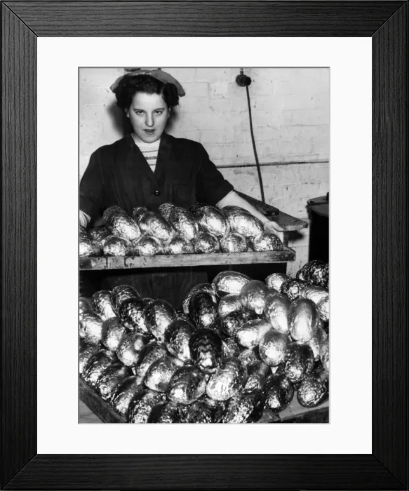 Framed Print : Mary Timney brings out a finished tray of eggs, which are wrapped Framed Print : Mary Timney brings out a finished tray of eggs, which are wrapped