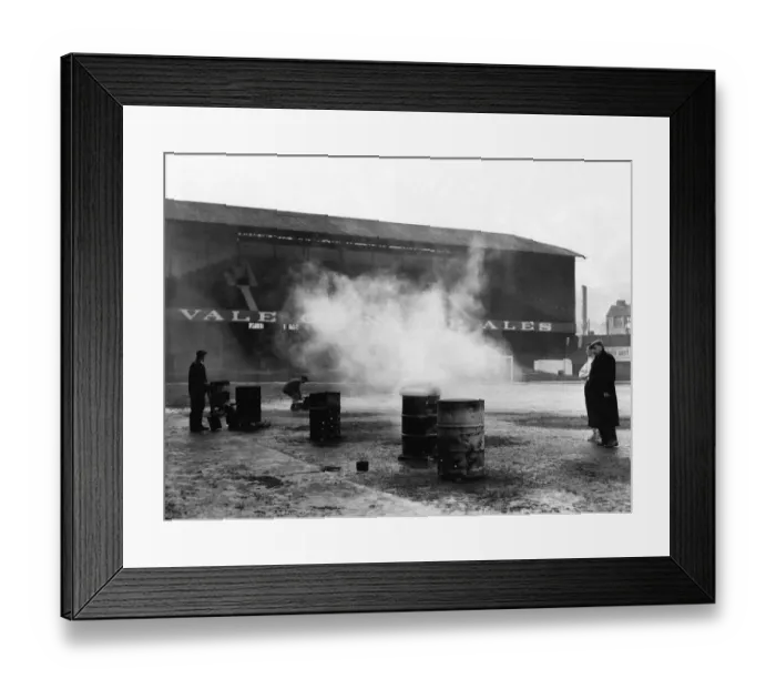 Framed Print : Sport - Football - Swansea City - Vetch Field - Groundsmen try to soften the frozen Vetch