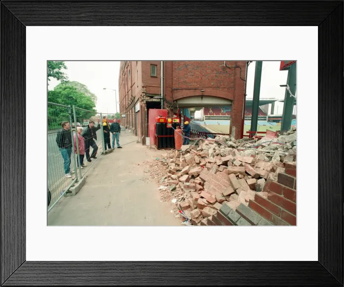 Framed Print : The Holte End stand at Villa Park is demolished by workmen. 10th May 1994 Framed Print : The Holte End stand at Villa Park is demolished by workmen. 10th May 1994