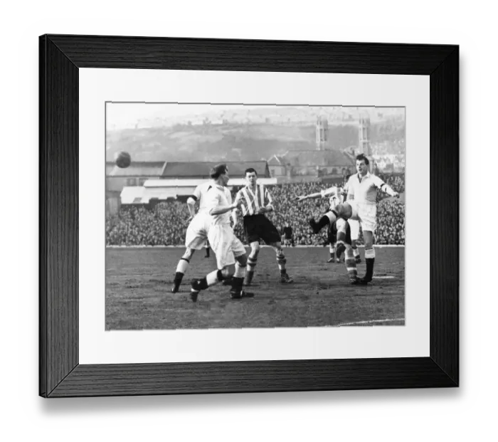 Framed Print : Sport - Football - Swansea Town - Elwell the Swansea full back boots the ball away to