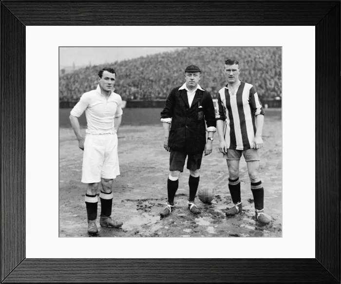 Framed Print : Swansea v Stoke FA Cup Tie. Joe Sykes of Swansea with referee P Harper Framed Print : Swansea v Stoke FA Cup Tie. Joe Sykes of Swansea with referee P Harper