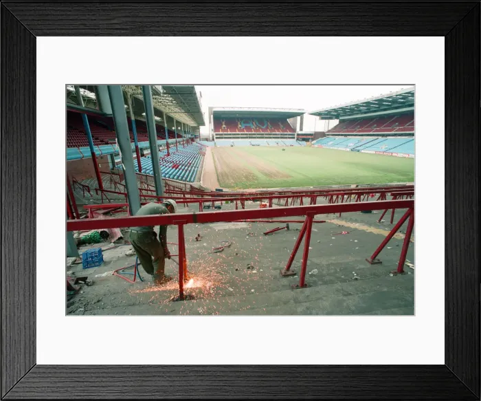 Framed Print : The Holte End stand at Villa Park is demolished by workmen. 10th May 1994 Framed Print : The Holte End stand at Villa Park is demolished by workmen. 10th May 1994