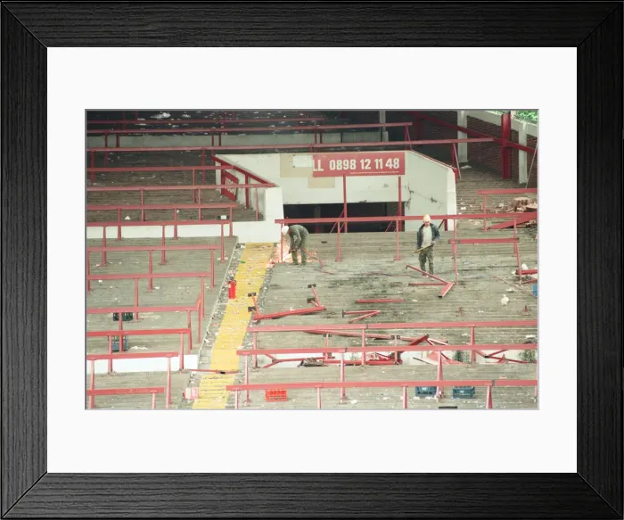 Framed Print : The Holte End stand at Villa Park is demolished by workmen. 10th May 1994 Framed Print : The Holte End stand at Villa Park is demolished by workmen. 10th May 1994