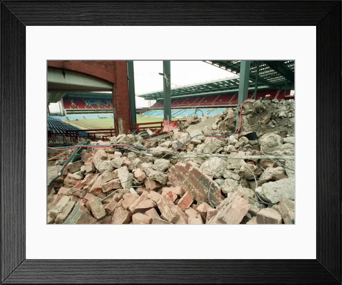 Framed Print : The Holte End stand at Villa Park is demolished by workmen. 10th May 1994 Framed Print : The Holte End stand at Villa Park is demolished by workmen. 10th May 1994