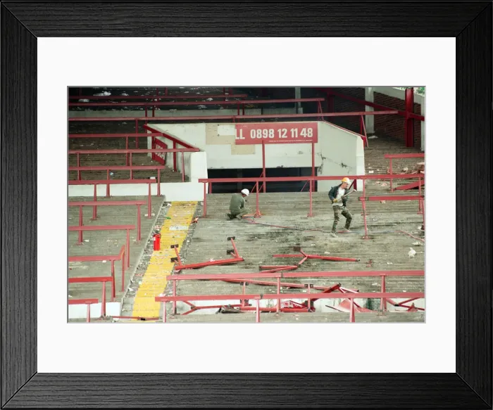 Framed Print : The Holte End stand at Villa Park is demolished by workmen. 10th May 1994 Framed Print : The Holte End stand at Villa Park is demolished by workmen. 10th May 1994