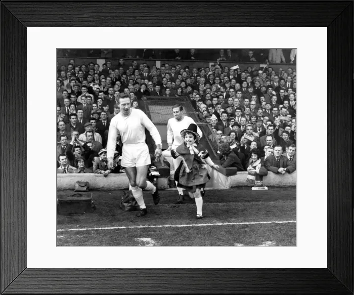 Framed Print : Sport - Football - Swansea Town - Swans full back and captain Brian Hughes is accompanied Framed Print : Sport - Football - Swansea Town - Swans full back and captain Brian Hughes is accompanied