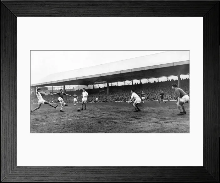 Framed Print : s Brian Walsh sends in a low drive which puts the visitors three goals up at the Vetch