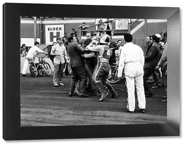 Flare up at Belle Vue. Officials rush in to separate Belle Vue rider Alan Wilkinson
