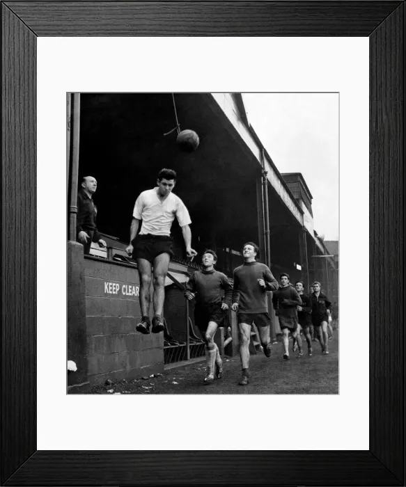 Framed Print : Welsh footballer Mel Nurse goes up for the ball during heading practice Framed Print : Welsh footballer Mel Nurse goes up for the ball during heading practice