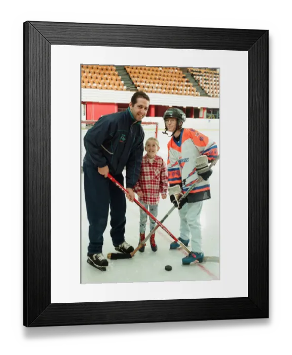Framed Print : Rachel Toth watches as her mam Mary and Sheffield Steelers Ice Hockey player Andre Malo