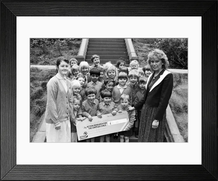 Framed Print : Edgerton fund raisers... watched by school friends, Amy Lodge (left)