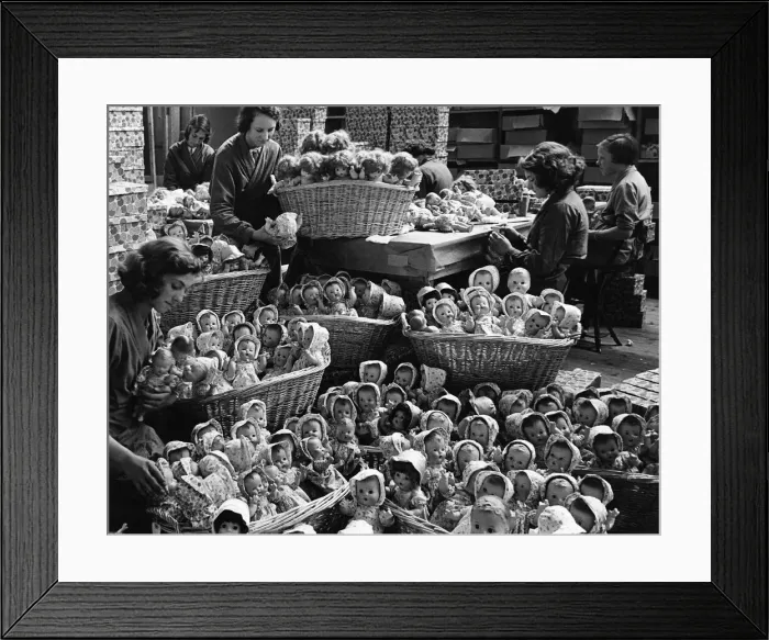 Framed Print : Some of the 2000 dolls that are produced each day in the dressng room. 25th July 1938