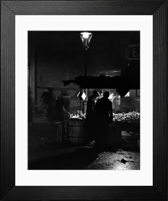 Framed Print : A night scene in Portobello Road market London. 8th October 1936