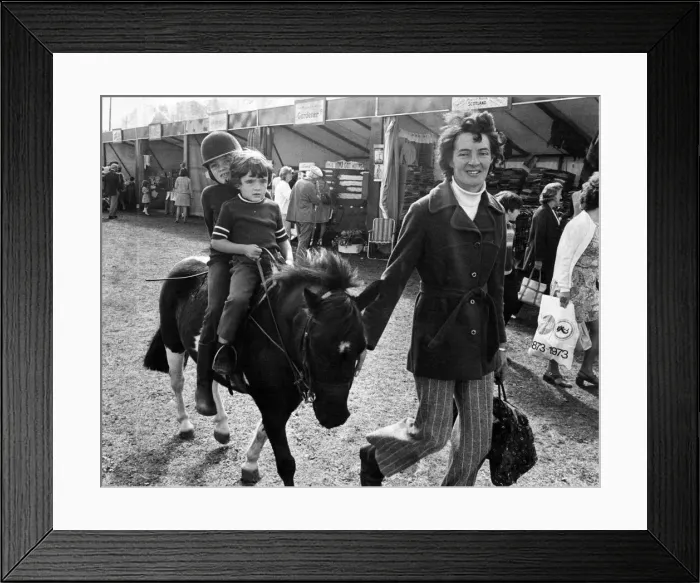 Framed Print : Children enjoy a pony ride in Southport. Circa 1973