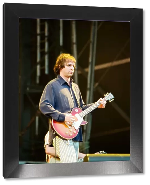 Peter Buck. R. E. M. in concert at the Galpharm Stadium. 25th July 1995