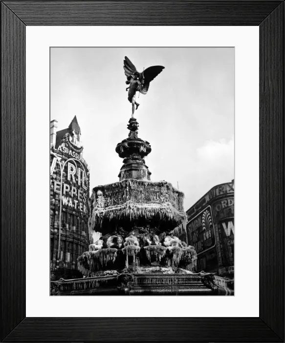 Framed Print : The statue of Eros in Piccadilly Circus, London covered in frozen icicles Framed Print : The statue of Eros in Piccadilly Circus, London covered in frozen icicles