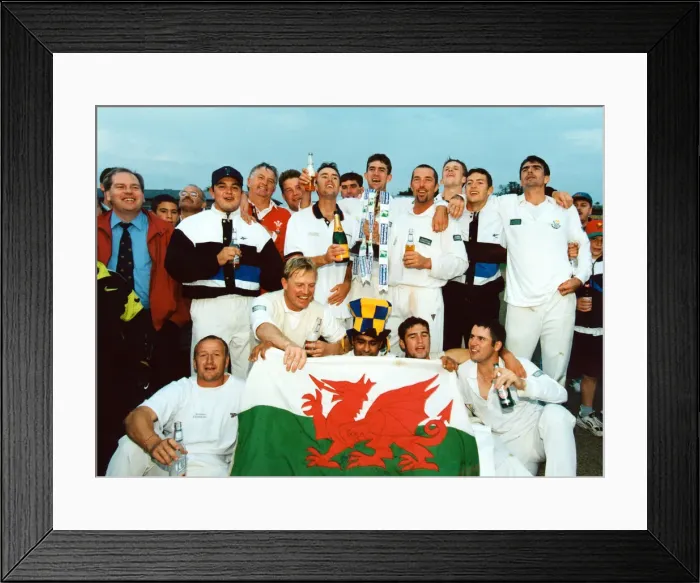 Framed Print : Glamorgan celebrate their championship with trophy, champagne - and the national flag Framed Print : Glamorgan celebrate their championship with trophy, champagne - and the national flag