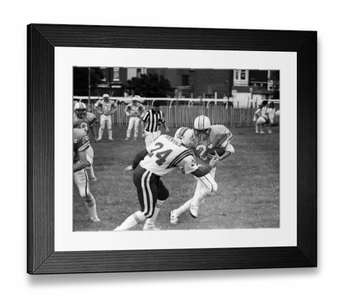 Framed Print : British Steel Gala - A member of the Scunthorpe Steelers tries to dodge a tackle by an Framed Print : British Steel Gala - A member of the Scunthorpe Steelers tries to dodge a tackle by an