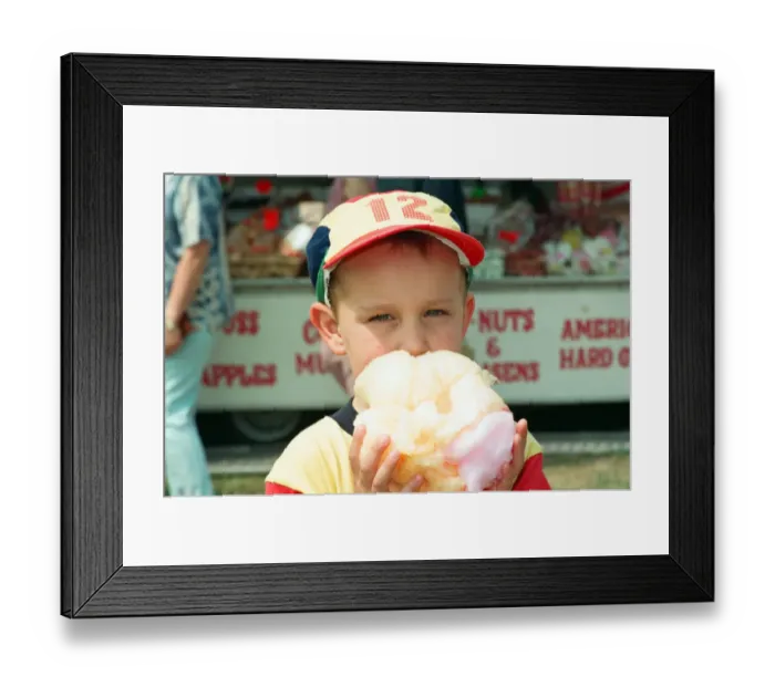 Framed Print : The British Steel Gala held at Kirkleatham. 3-year-old Luke Peacock tucks into his candy Framed Print : The British Steel Gala held at Kirkleatham. 3-year-old Luke Peacock tucks into his candy