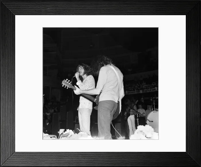 Framed Print : Robert Plant, lead singer of rock group Led Zeppelin, performing on stage during a Framed Print : Robert Plant, lead singer of rock group Led Zeppelin, performing on stage during a