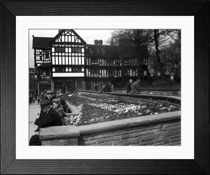 Framed Print : Shoppers enjoy the spring sunshine and the flower beds outside Timothy Whites in Trinity Framed Print : Shoppers enjoy the spring sunshine and the flower beds outside Timothy Whites in Trinity
