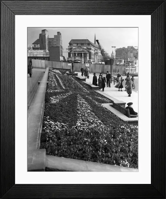 Framed Print : Shoppers enjoy the spring sunshine and the flower beds outside Holy Trinity Church Framed Print : Shoppers enjoy the spring sunshine and the flower beds outside Holy Trinity Church