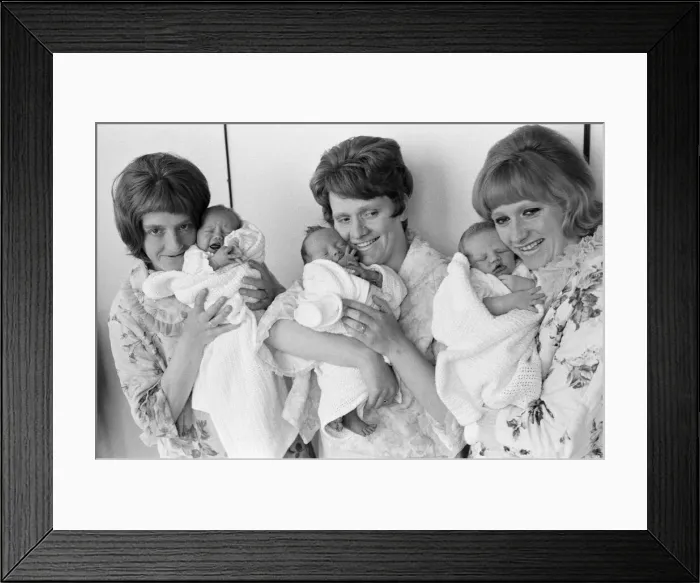 Framed Print : All mothers feel no doubt that they have achieved something special as they hold their Framed Print : All mothers feel no doubt that they have achieved something special as they hold their