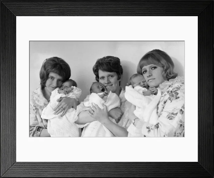 Framed Print : All mothers feel no doubt that they have achieved something special as they hold their Framed Print : All mothers feel no doubt that they have achieved something special as they hold their