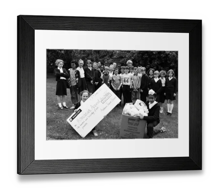 Framed Print : Sock it to them... Pupils at Ashbrow Junior School, who have been helping Romanian