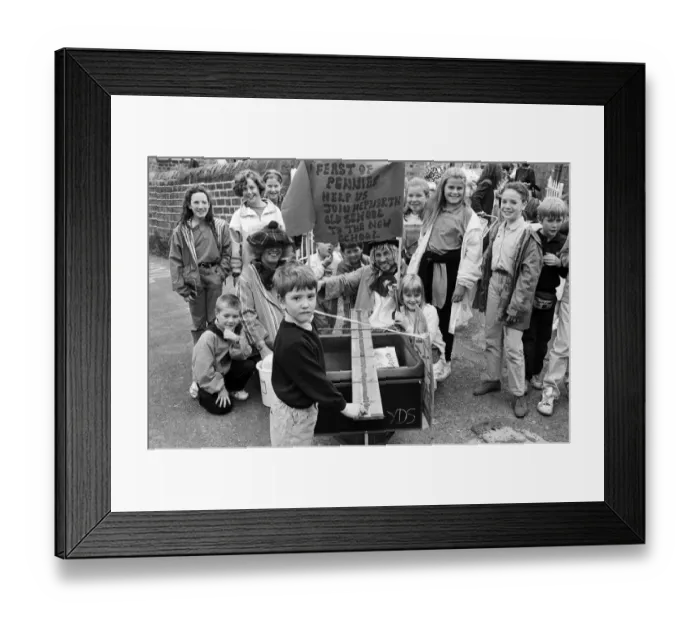 Framed Print : Precious pennies... Michael Dempsey adds one more coin to a chain of cash that went Framed Print : Precious pennies... Michael Dempsey adds one more coin to a chain of cash that went
