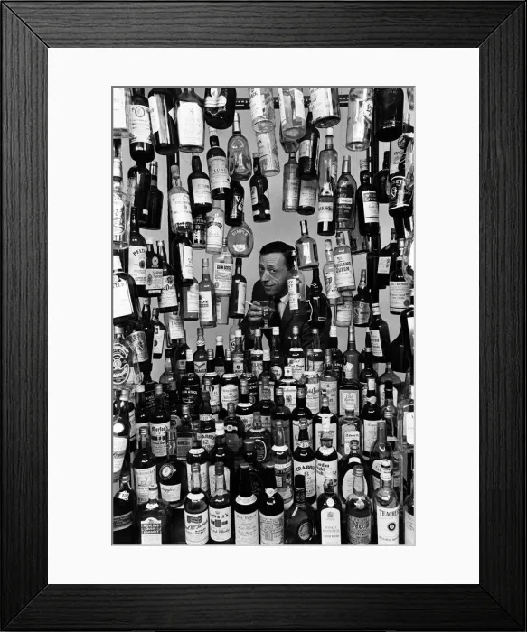 Framed Print : Sunday Mirror writer Stanley Shivas with the 137 best selling Scottish whiskeys Framed Print : Sunday Mirror writer Stanley Shivas with the 137 best selling Scottish whiskeys