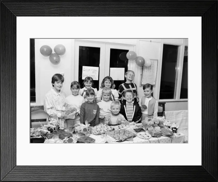 Framed Print : Pictured at their cake stall are these Thurstonland youngsters who have raised 100 for Framed Print : Pictured at their cake stall are these Thurstonland youngsters who have raised 100 for
