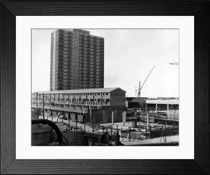 Framed Print : A 22-storey block - shops at ground level and flats above - dominates the scene of more Framed Print : A 22-storey block - shops at ground level and flats above - dominates the scene of more