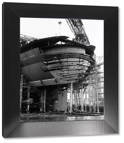 The rudder of the QE2 is held in position with winches and wooden blocks to await