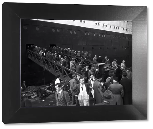 Workmen leaving the Cunard Liner The Queen Elizabeth, 30th January 1953