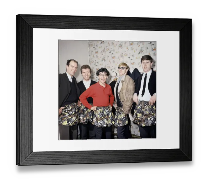 Framed Print : Freddie and the Dreamers pop group pose with swimming trunks presented to them by their