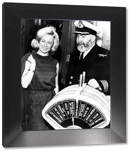 Miss Liverpool, Maureen Martin, with Commodore William E Warwick CBE RD RNR who was