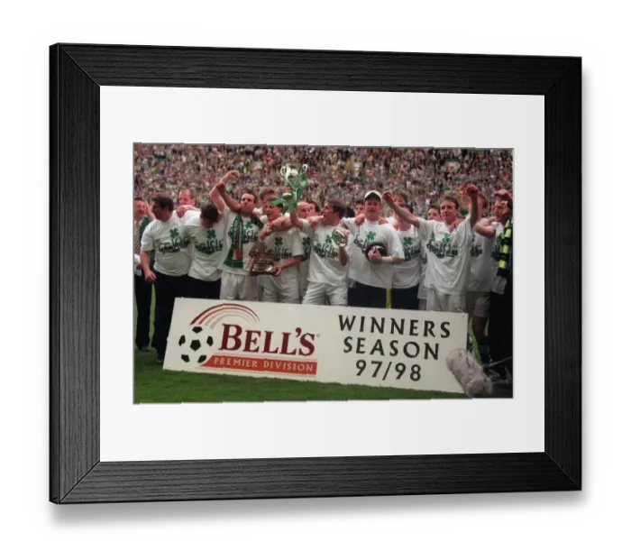 Framed Print : Celtic football players celebrate winning the championship 1998 with trophy cup winners