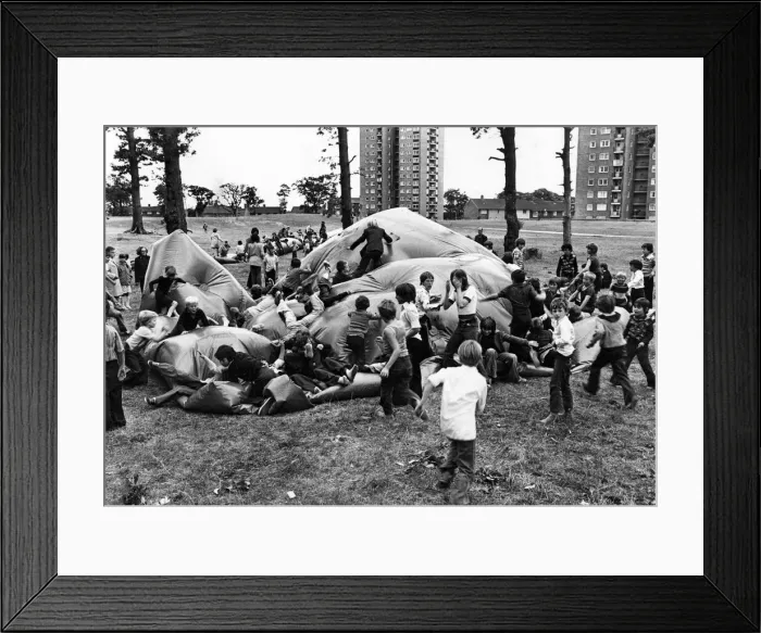 Framed Print : Giant inflatables have been putting a bounce into the summer holidays for children in Framed Print : Giant inflatables have been putting a bounce into the summer holidays for children in