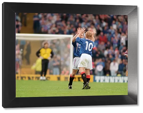 Stuart McCall Rangers football payer gives a Gordon Durie ten after their victory over