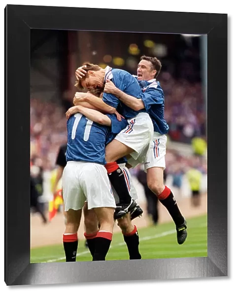 Brian Laudrup Rangers football player is mobbed by skipper Richard Gough