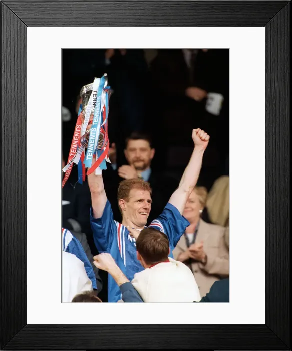 Framed Print : Rangers 5 - 1 Heart of Midlothian. Gordon Durie holds up the Scottish cup after his Framed Print : Rangers 5 - 1 Heart of Midlothian. Gordon Durie holds up the Scottish cup after his