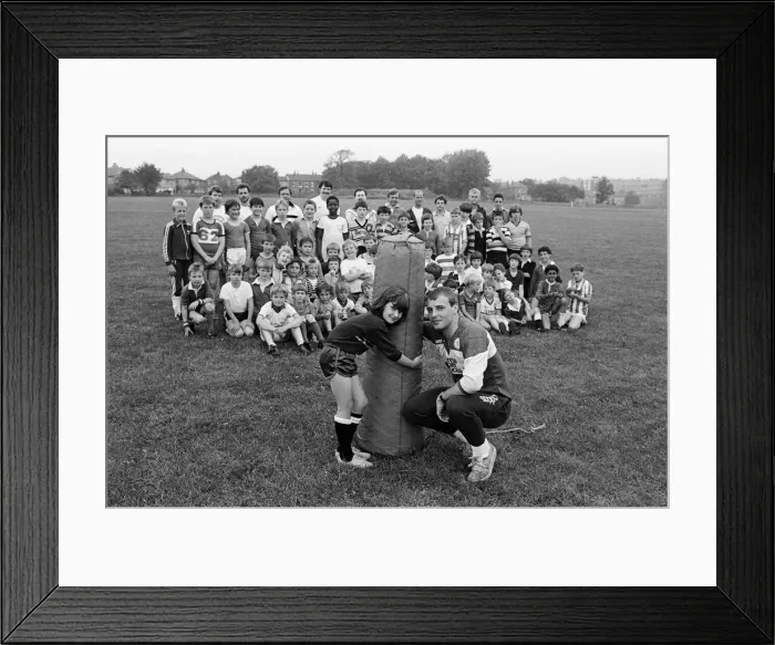 Framed Print : Attempting to make her mark in the mens game of Rugby League is nine year old Sarah