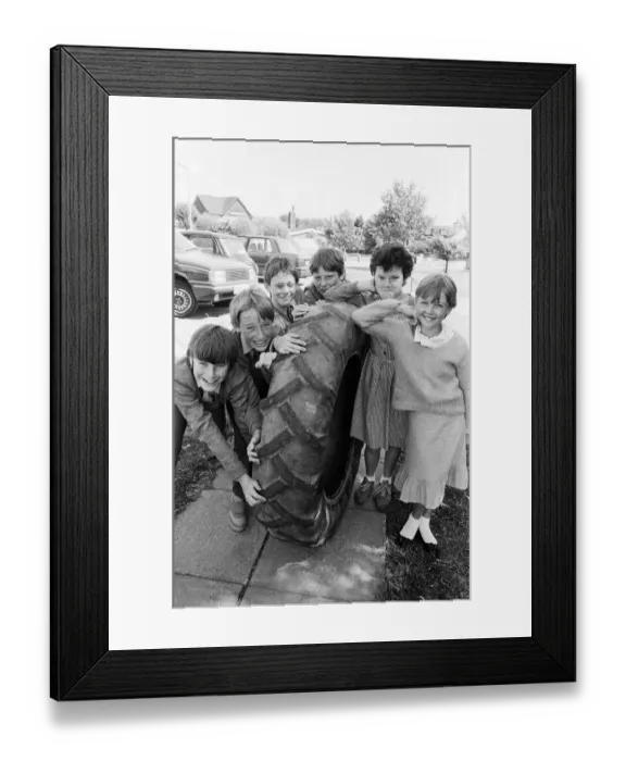 Framed Print : Roll em... Giving their giant tyre a last big push up these boys from Battyeford Framed Print : Roll em... Giving their giant tyre a last big push up these boys from Battyeford