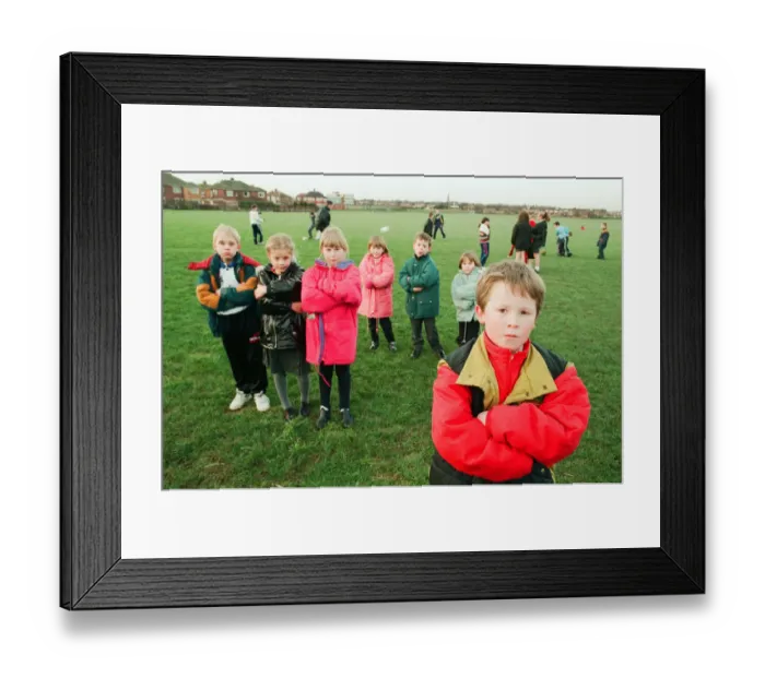 Framed Print : Hands off our playing field. Defiant youngsters, schoolchildren from Saltscar School