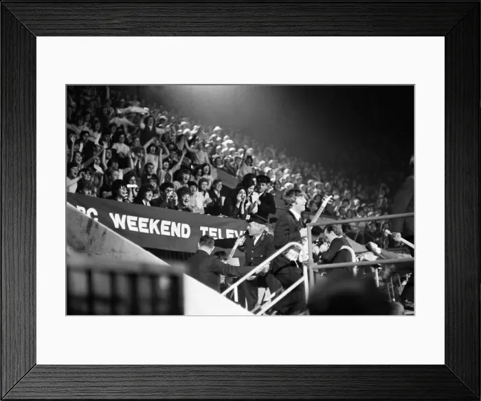 Framed Print : John Lennon of The Beatles fighting to get on stage during the NME poll Winners all star Framed Print : John Lennon of The Beatles fighting to get on stage during the NME poll Winners all star