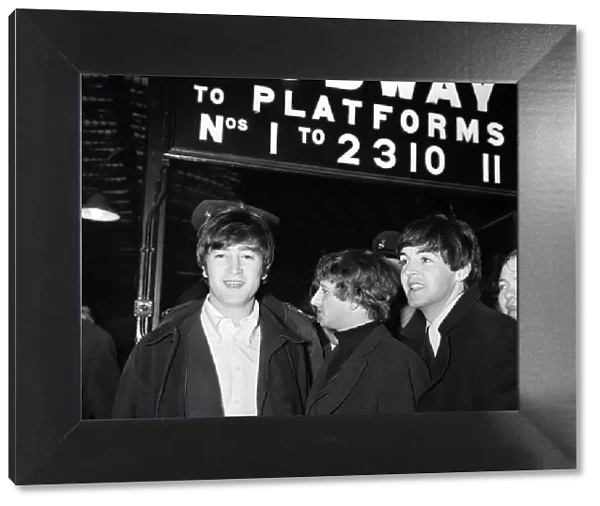 The Beatles at paddington Station about to board the train for the filmining for '