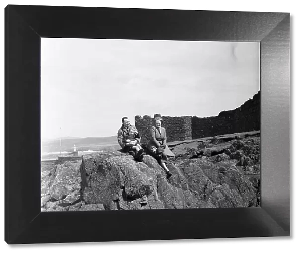 A family enjoys the view in Peel, Isle of Man. May 1954