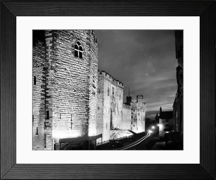 Framed Print : Floodlit Caernarfon castle at night. Gwynedd, Wales. 6th August 1935 Framed Print : Floodlit Caernarfon castle at night. Gwynedd, Wales. 6th August 1935